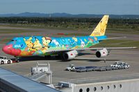 JA8958 @ RJCC - Blue Pokemon B744 pushed-back - by FerryPNL