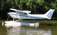 N736NN @ OSH - long range shot from grassy bank - by magnaman