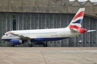 G-EUUS @ EGLL - Test registration was F-WWIF. Outside T.B.A. British Airways East Base. Note the architecture of the hangar, built in the 1950s, one of the few buildings left from that era. - by Glyn Charles Jones