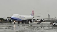 B-18720 @ KSFO - First rain of the season. SFO 2018. - by Clayton Eddy