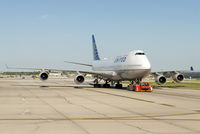 N128UA @ KORD - Under tow at O'Hare. - by Arjun Sarup