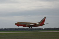N767SW @ KSMF - Southwest 1999 Boeing 777-7H4 in early 2000s color scheme lifting off @ Sacramento Intl Airport, CA