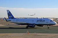 N715JB @ KEWR - Pulling into the gate at Newark International - by Daniel L. Berek