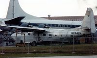 N2442H @ MIA - With a fascinating range of previous owners, N442H sits minus control surfaces, fairings, and many other parts at MIA in March 1990.  Later superbly restored, find her on this site, at N2950 to see just what TLC and lots of $$$ can achieve. - by Goat66