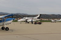 N142TL @ CMA - 2010 Embraer SA EMB-500 PHENOM 100 Light Business Jet, 2 P&W Canada PW617 turbofans with FADEC each rated at 1,695 lb st., spotted to transient ramp - by Doug Robertson