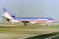 N303FE @ KLAX - Federal Express DC-10-30F rolling off 25L at Los Angeles apprx March 1990 - by Tom vance