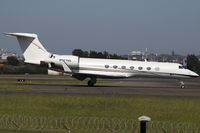 N977HS @ YSSY - taxi from 16L - by Bill Mallinson