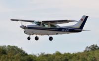 HB-CHZ @ EGFH - Visiting Cessna 210L Centurion departing Runway 22. - by Roger Winser