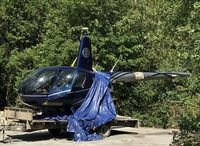 G-CTFL @ EGTB - Following a collision with another R44 (G-HYND) at Cumbernauld on 5.5.2018 the wreckage now resides awaiting repair at Booker. - by Chris Holtby