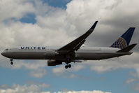 N673UA @ EGLL - Landing RWY 27L - by DominicHall