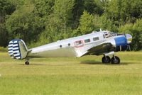 N223CM @ LFFQ - Beech D18S, Taxiing to parking area, La Ferté-Alais airfield (LFFQ) Airshow 2015 - by Yves-Q