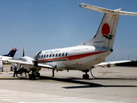VH-XFW @ YBBN - Low Res rear Port side view of Flight West EMB120RT Brasilia VH-XFW (Cn 120181), shown in original Flight West livery, at Brisbane Airport YBBN on 03Jan1994. Photo taken after a 0.7 hour flight from Bundaberg in this aircraft. - by Walnaus47