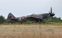 G-SPIT @ EGFH - Spitfire marked MV268/JE-J departing Runway 04. - by Roger Winser
