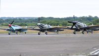G-AWHC @ EGFH - Two seat Buchon coded Red 11 with two Spitfires, G-IBSY and G-SPIT. - by Roger Winser