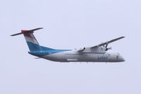 LX-LQI @ EGLC - Disappearing into the low cloud on departure from London City. - by Graham Reeve
