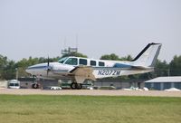 N207ZM @ KOSH - Beech 58 - by Mark Pasqualino