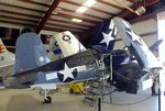 N451FG @ KADS - Vought (Goodyear) FG-1D (F4U) Corsair in the maintenance hangar at the Cavanaugh Flight Museum, Addison TX