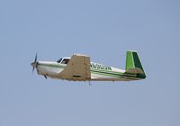 N6909N @ KOSH - Mooney M20C - by Mark Pasqualino