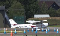 G-FLOW @ EGSX - Parked at North Weald undergoing pre-flight checks - by Chris Holtby