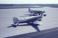 G-AMWV @ EBOS - Air Ulster G-AMWV and Belgian Air Force C-54A  KX-1 at Ostend Airport in late 1960's. - by Rigo VDB