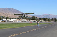 N6094D @ SZP - 1958 Piper PA-18A 150 SUPER CUB, Lycoming O-320 150 Hp, swoop-dive and climb for successfull banner tow pickup on first attempt. - by Doug Robertson