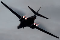 86-0126 @ KOSH - Rear view of USAF B-1B AF 86-0126 Cn 86 starting a Dusk ‘Afterburner Vapour Run’, with wings swept forward. Photo taken at the start of the Night Airshow, at Air Venture Oshkosh KOSH on 26Jul2017. Vapour forms as the aircraft accelerates towards Mach 1. - by Walnaus47