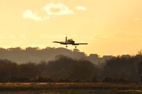 G-CGWG @ EGFH - Resident RV-7 aircraft landing Runway 04 at dusk. - by Roger Winser