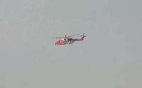 0268 @ EGFH - Distant view of the Royal Norwegian Air Force search and rescue helicopter seen on trials to the North of the airport. Registered ZZ103 before delivery to the air force in Norway. - by Roger Winser