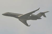 D-ACCF @ KLAX - German BD700 taking-off from a hazy LAX - by FerryPNL