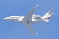 N318QS @ KLAX - Netjets EMB505 disappearing into the marine layer - by FerryPNL