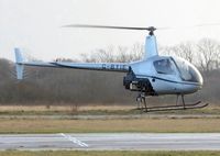 G-BYIE @ EGFH - Resident R-22 Beta helicopter operated by HeliAir Wales. - by Roger Winser