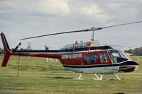 VH-BLR @ YMMB - Stbd side view of Jayrow Helicopters Bell 206B JetRanger II VH-BLR Cn 1309 (in red-white-black livery) at Moorabbin YMMB  Victoria in 1976. - by Walnaus47