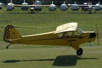 N38615 @ EDST - Piper J3C-65 Cub landing at Hahnweide airfield, Germany. OTT 2019