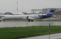 ES-ACG @ EGSH - Dvalin Viking under tow by Air Livery to Stand 7 following respray. This is the first CRJ to be painted in the new SAS livery. She later departed Ljubljana (LJU).