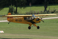 HB-ODX @ EDST - Piper L-4J Grasshopper (J3C-65D Cub) landing at Hahnweide airfield, Germany. OTT 2019