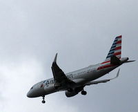 N12028 @ BOG - On final approach over Bogota's Botanical Gardens - by Bruce Raynor