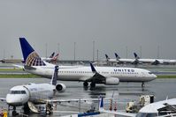 N37468 @ KSFO - Rainy morning Coronavirus parking far side of picture. SFO 2020. - by Clayton Eddy