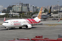 VT-AXM @ VABB - Taxiing in at CSIA as IX21 from Vijayawada.  Mehrangarh Fort is visible on the colourful tail. - by Arjun Sarup