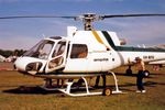 VH-NFO @ YSFS - Port side front end of New AS-350B helicopter VH-NFO Cn 1823, being closely inspected while on static display at the Schofields Air Show (held at HMAS Nirimba) on 10Nov1985. (This helo was First Registered in Australia on 09Oct1985.) - by Walnaus47