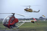 VH-GMD @ YMMB - Low Res view of Jayrow Hughes 269A helicopter VH-GMD (Cn 73-0258) at the Jayrow Helicopter Base at Moorabbin YMMB on 14Jun1968. Airfast Bell 205 VH-NSP Cn 30032  is about to land in the background. - by Walnaus47