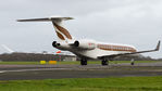 OE-IIL @ EGKB - vacating runway 21 for the Bombardier apron. - by Tim Lowe