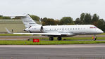 9H-AMN @ EGKB - Returning to the Bombardier Hangar after a test flight. - by Tim Lowe