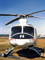 VH-AHH @ YSCB - Front view of parked Bell 412 Helicopter VH-AHH Cn 33084 Code H, photographed at Canberra Airport in Mar 1987. Note pop-out floats on the skids. (Later Regd to NSCA as VH-NSV 16JUN87 - 28MAY89.) Previously Registered as N3172D in USA. - by Walnaus47