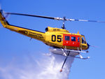 VH-NSM @ YSCB - NSCA Bell 205A-1 VH-NSM Cn 30002 Code 05 demonstrates a water dump at the 1988 (Bi-Centennial) Canberra Air Pageant on 13Mar1988. This Helo (wearing a 'Conservation - Forests and Lands' logo) is equipped with a water tank and filler hose, for Fire-fightin - by Walnaus47