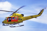 VH-NSO @ YSFS - Rear Port side view of NSCA Bell 412 VH-NSO Cn 33089 Code 11 flying past at Schofields/ NAS Nirimba (YSFS) on 10Nov1985. The helo is equipped with pop-out floats and a Nite-Sun searchlight. (Helo with NSCA 08MAR85 - 29MAY89 - later Sold to USA as N167EH.) - by Walnaus47