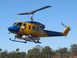 N234PH @ YBUD - Front Portside view of McDermott Aviation Bell 214B-1 Biglifter N234PH Cn 28050 hovering at Bundaberg Airshow at Bundaberg Airport YBUD on 17Jul2005. Equipped with ‘under-cabin’ water tank. The operator was based at Cooroy QLD.