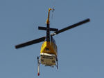 N234PH @ YBUD - Rear underside view of McDermott Aviation Bell 214B-1 Biglifter N234PH Cn 28050 departing at Bundaberg Airshow at Bundaberg Airport YBUD on 17Jul2005. Equipped with ‘under-cabin’ water tank, with ‘pick-up’ hose extended.