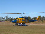 N234PH @ YBUD - Front Portside view of McDermott Aviation Bell 214B-1 Biglifter N234PH Cn 28050 parked at Bundaberg Airshow at Bundaberg Airport YBUD on 17Jul2005. Equipped with ‘under-cabin’ water tank, with ‘pick-up’ hose retracted.