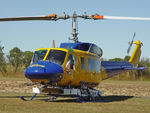 N234PH @ YBUD - Close cropped Front Portside view of McDermott Aviation Bell 214B-1 Biglifter N234PH Cn 28050 parked at Bundaberg Airshow at Bundaberg Airport YBUD on 17Jul2005. Equipped with ‘under-cabin’ water tank, with ‘pick-up’ hose retracted.