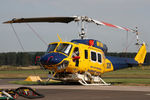 VH-SUH @ YLTV - Front Portside telephoto view of McDermott Aviation Bell 214B-1 VH-SUH Cn 28017 HeliTack 339, taken at Latrobe Valley Airport (YLTV) Morwell on 22Feb2015. Fitted with a ‘HeliLift’ water/ fire retardant tank under the cabin.